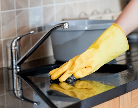 Cleaner preparing oven cleaning equipment safely