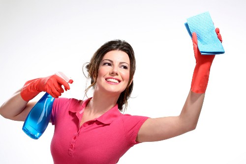 Local domestic cleaner preparing a tidy living room in West Ealing